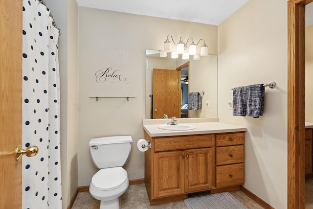 full bathroom with toilet, baseboards, vanity, a shower with shower curtain, and tile patterned floors