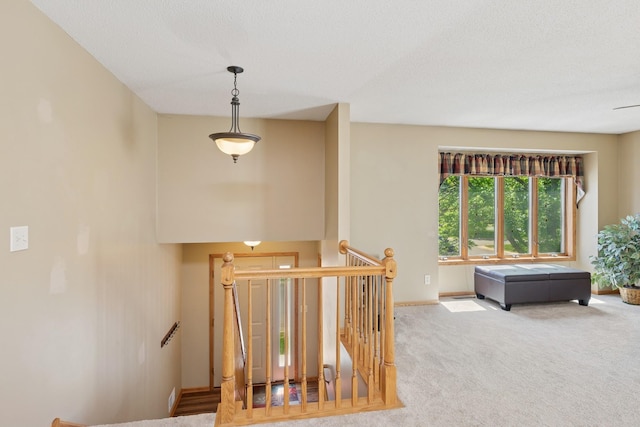 staircase with carpet floors and baseboards
