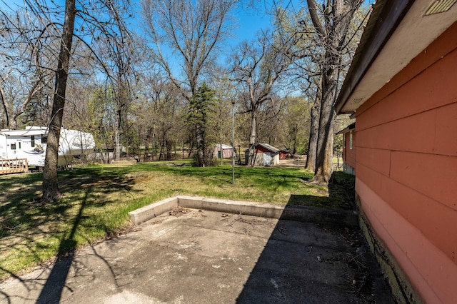 23711 Clarissa Haven Dr, Girard Twp, MN 56551 - view of green lawn featuring a patio