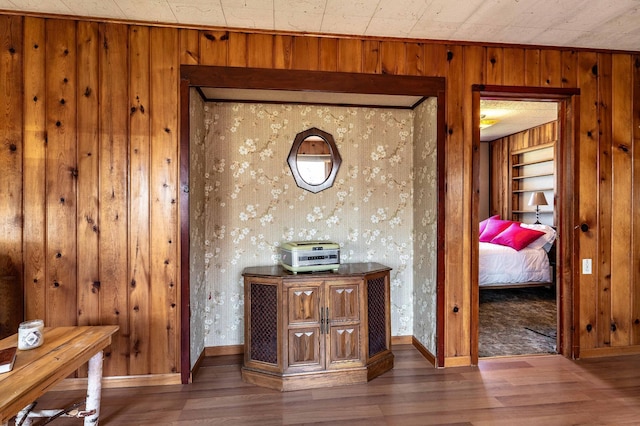 23711 Clarissa Haven Dr, Girard Twp, MN 56551 - hallway with wood finished floors, wooden walls, and baseboards