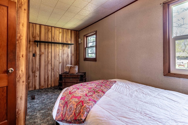 23711 Clarissa Haven Dr, Girard Twp, MN 56551 - carpeted bedroom with wooden walls