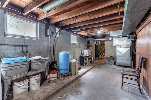 23711 Clarissa Haven Dr, Girard Twp, MN 56551 - basement with oil tank, a water pressure tank, and heating unit