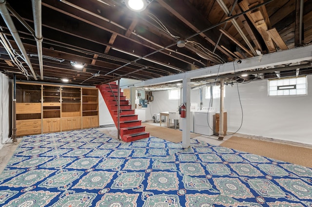 basement with independent washer and dryer and stairs