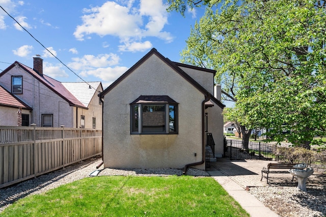 rear view of property with stucco siding