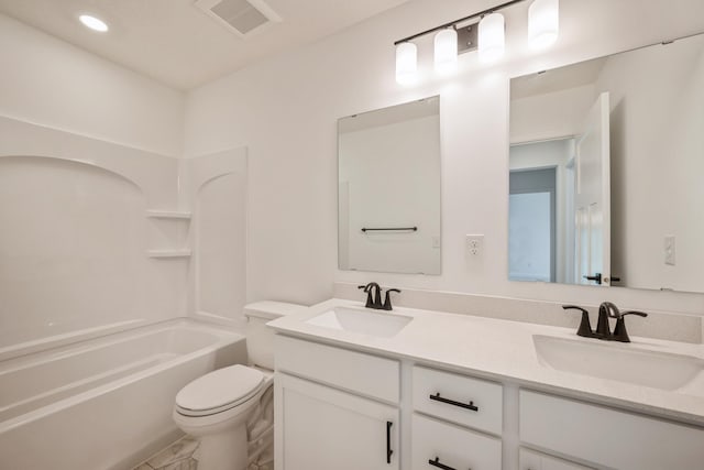 full bath featuring toilet, double vanity, marble look tiles, shower / washtub combination, and recessed lighting