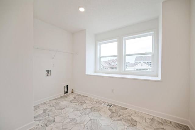 washroom with hookup for a washing machine, baseboards, and recessed lighting