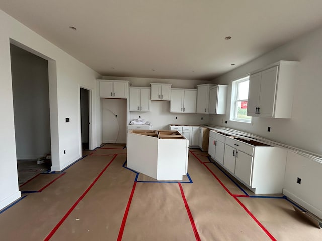 11350 84th St NE, Otsego, MN 55330 - kitchen with a kitchen island and white cabinetry