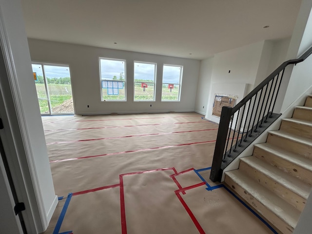 11350 84th St NE, Otsego, MN 55330 - unfurnished living room featuring stairway and carpet floors