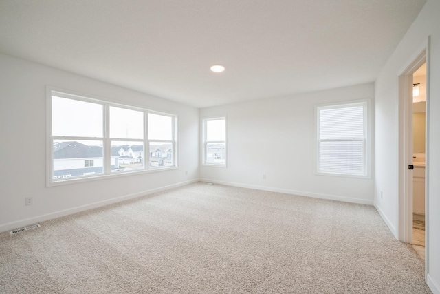 11350 84th St NE, Otsego, MN 55330 - spare room featuring light colored carpet, baseboards, and recessed lighting