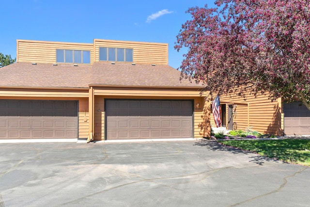 38546 Grand Ave, North Branch, MN 55056 - view of front of home with concrete driveway and roof with shingles