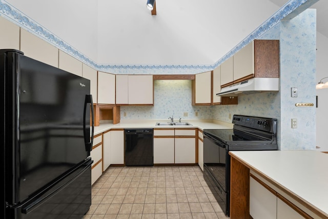 38546 Grand Ave, North Branch, MN 55056 - kitchen with black appliances, under cabinet range hood, light countertops, a sink, and wallpapered walls