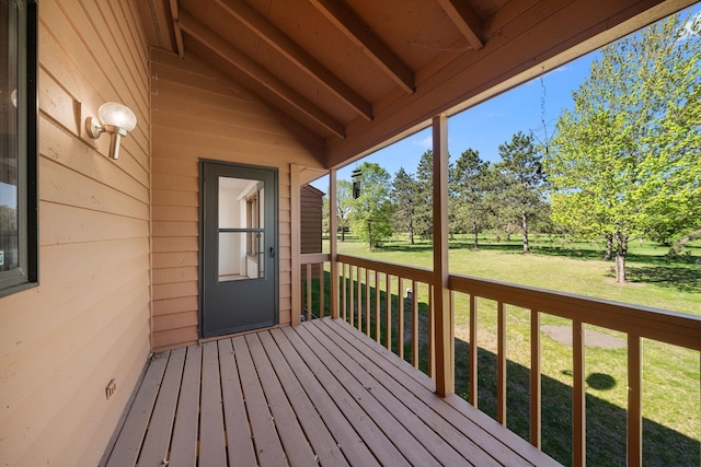 38546 Grand Ave, North Branch, MN 55056 - deck featuring a lawn and view of wooded area