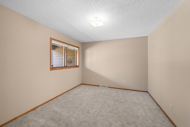 38546 Grand Ave, North Branch, MN 55056 - unfurnished room featuring carpet, baseboards, and a textured ceiling