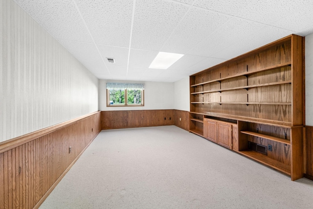 38546 Grand Ave, North Branch, MN 55056 - interior space with built in features, wood walls, wainscoting, and light colored carpet