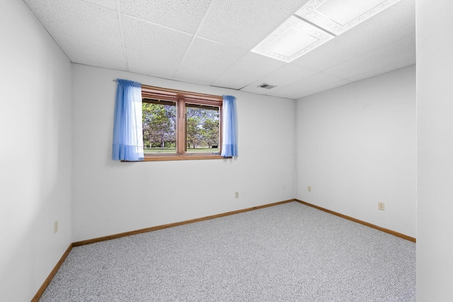 38546 Grand Ave, North Branch, MN 55056 - spare room featuring carpet, baseboards, and a paneled ceiling
