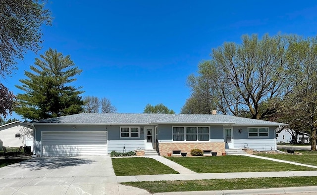 112 Walnut St, Dawson, MN 56232 - single story home with entry steps, a garage, driveway, and a front lawn