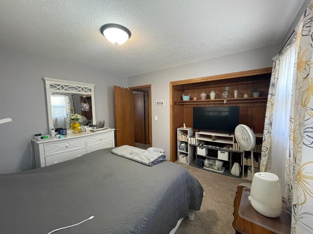 112 Walnut St, Dawson, MN 56232 - carpeted bedroom featuring a textured ceiling