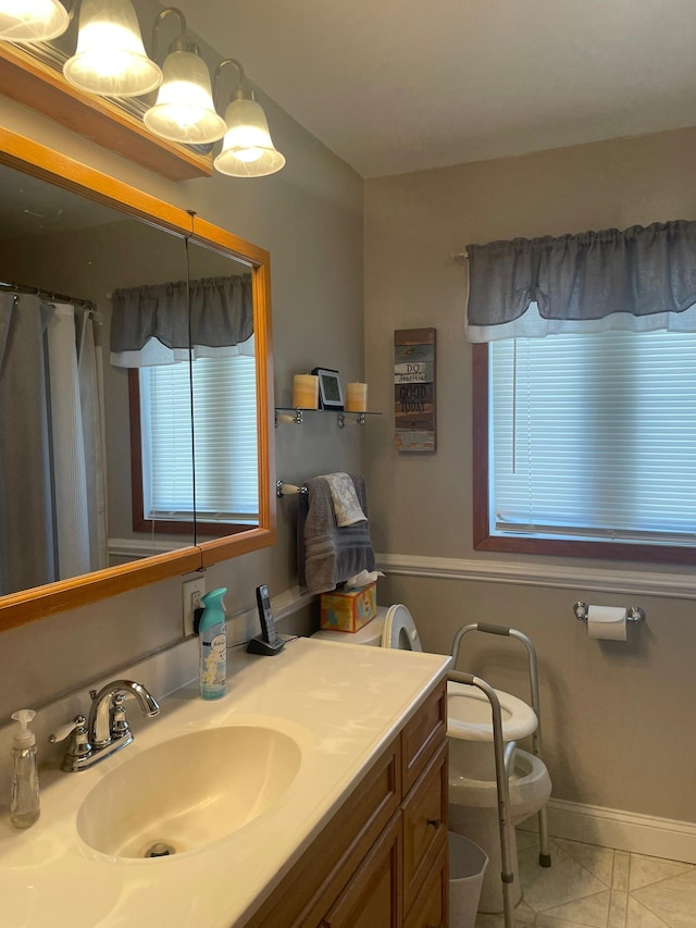 112 Walnut St, Dawson, MN 56232 - full bathroom with vanity, baseboards, toilet, and curtained shower