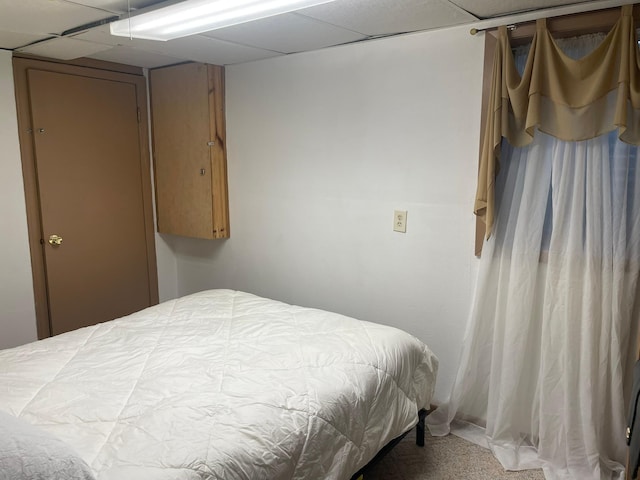 112 Walnut St, Dawson, MN 56232 - carpeted bedroom featuring a paneled ceiling