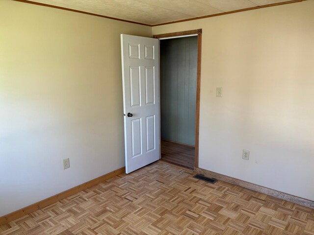 307 Deerwood Ln S, Onamia, MN 56359 - spare room featuring baseboards and crown molding