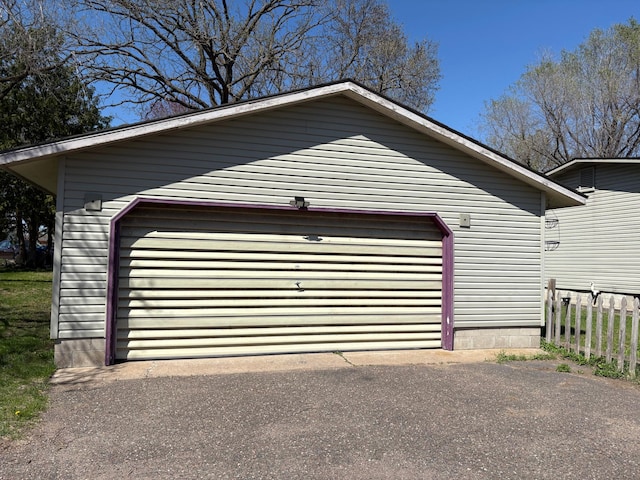 307 Deerwood Ln S, Onamia, MN 56359 - garage with fence