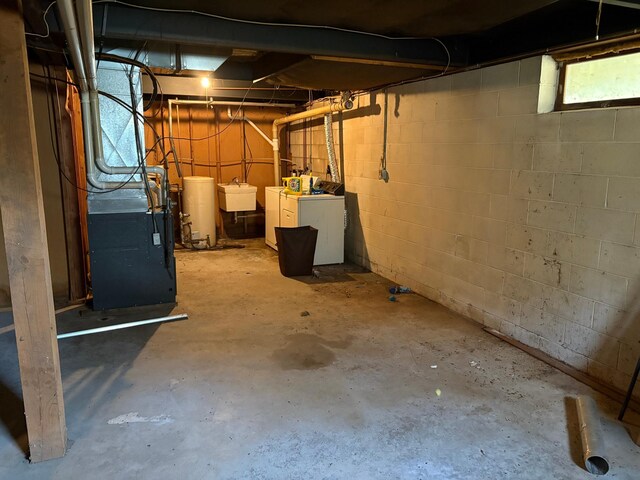 307 Deerwood Ln S, Onamia, MN 56359 - below grade area with washing machine and clothes dryer and a sink