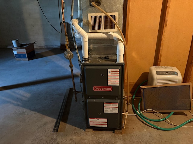 307 Deerwood Ln S, Onamia, MN 56359 - utility room featuring heating unit
