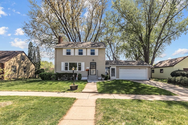 view of front of house with concrete driveway, a front yard, an attached garage, and a chimney