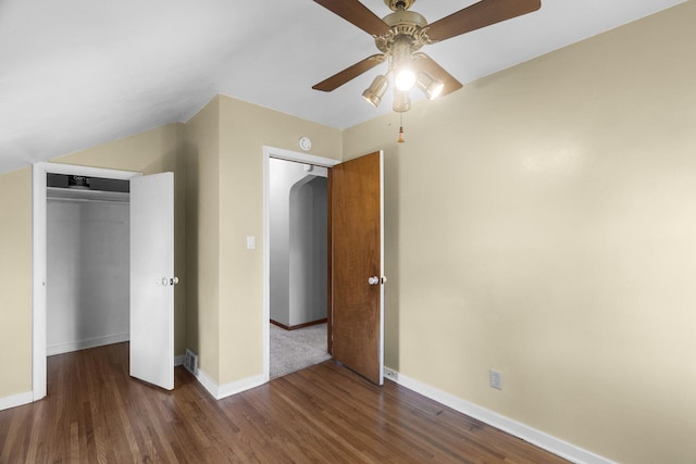 unfurnished bedroom with wood finished floors, baseboards, a closet, and ceiling fan
