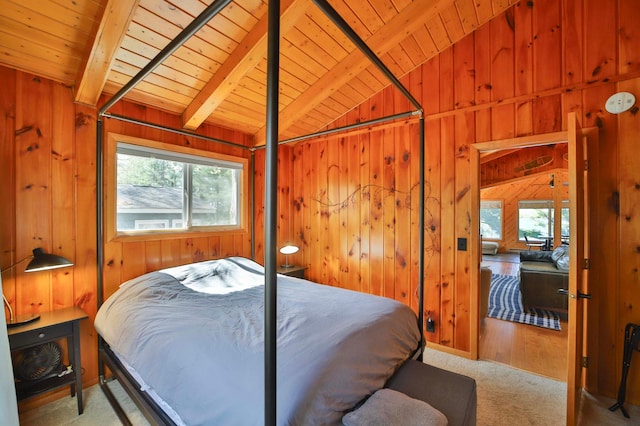 carpeted bedroom featuring wood ceiling, multiple windows, and wooden walls