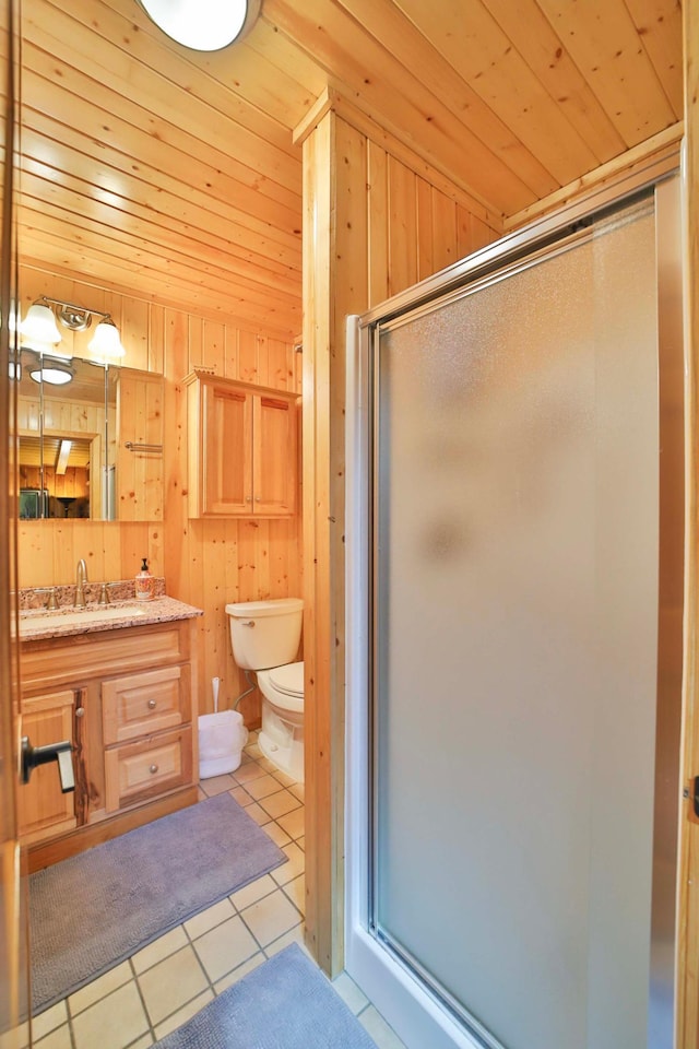 bathroom with a shower stall, tile patterned flooring, toilet, wooden walls, and wood ceiling
