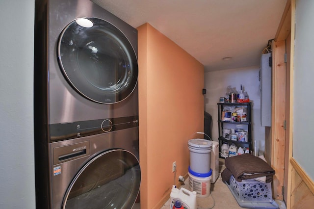 laundry area with stacked washer and clothes dryer