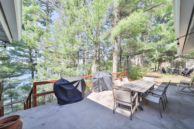 view of patio with outdoor dining area and area for grilling
