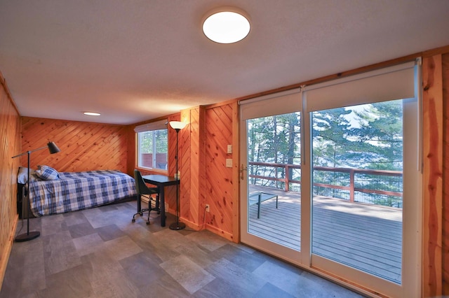 2202 Pine View Blvd, Motley, MN 56466 - bedroom featuring wooden walls, tile patterned floors, and access to outside