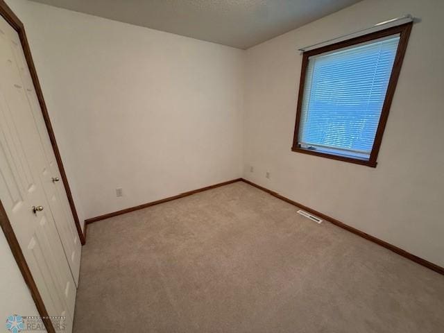 408 Np Ct, Breckenridge, MN 56520 - unfurnished bedroom with light colored carpet and baseboards