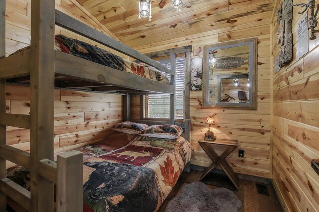 29917 Bay Dr, Danbury, WI 54830 - bedroom featuring wood walls, wood finished floors, and wooden ceiling