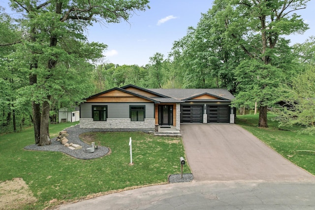 5191 159th Ave NW, Andover, MN 55304 - view of front facade with a garage, driveway, stone siding, and a front yard