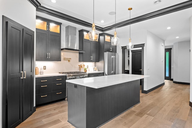 5191 159th Ave NW, Andover, MN 55304 - kitchen with wall chimney range hood, high end fridge, a kitchen island, decorative light fixtures, and light wood-style floors