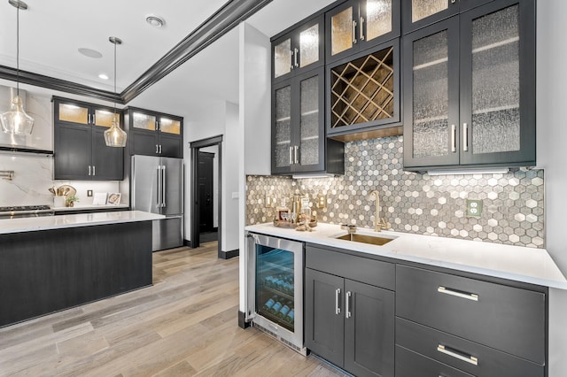 5191 159th Ave NW, Andover, MN 55304 - indoor wet bar with beverage cooler, high end fridge, light wood-style floors, hanging light fixtures, and backsplash