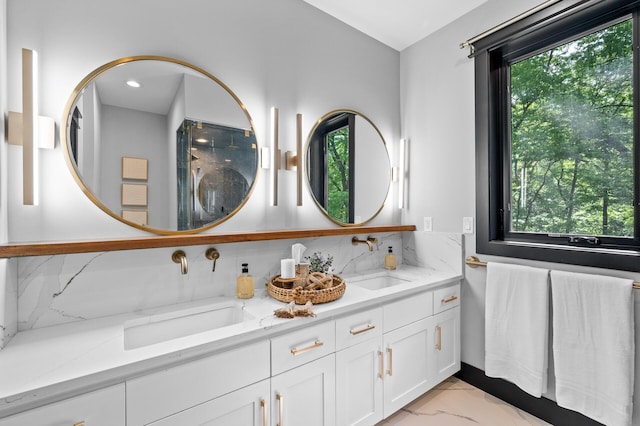 5191 159th Ave NW, Andover, MN 55304 - full bath with plenty of natural light, double vanity, marble look tiles, and tasteful backsplash