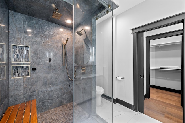 5191 159th Ave NW, Andover, MN 55304 - full bath with a marble finish shower, toilet, a spacious closet, and baseboards