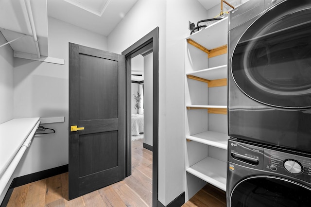 5191 159th Ave NW, Andover, MN 55304 - laundry area with stacked washer / drying machine and light wood finished floors