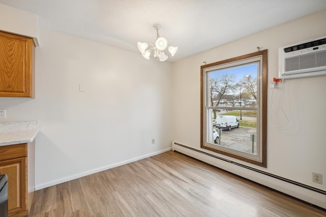 923 11th Ave S Unit 8, Hopkins, MN 55343 - unfurnished dining area with a chandelier, light wood-style flooring, baseboards, and baseboard heating