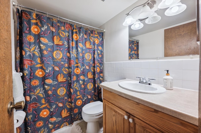 923 11th Ave S Unit 8, Hopkins, MN 55343 - bathroom featuring tile walls, toilet, curtained shower, and vanity