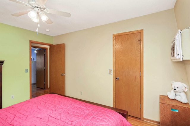 1494 21st Ave NW Unit 4, New Brighton, MN 55112 - bedroom with light wood-type flooring, a ceiling fan, and baseboards