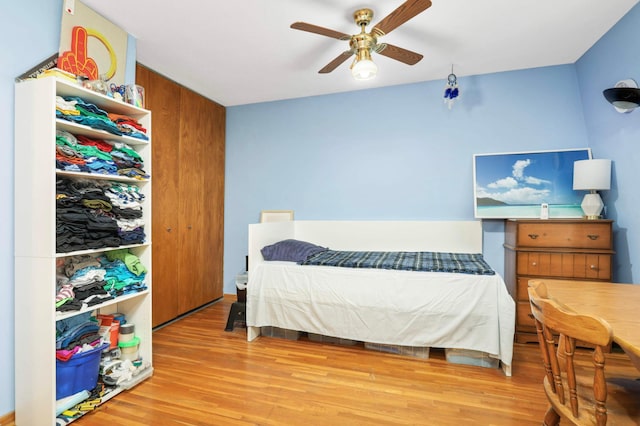 1494 21st Ave NW Unit 4, New Brighton, MN 55112 - bedroom with light wood finished floors and ceiling fan