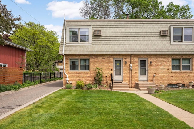 1494 21st Ave NW Unit 4, New Brighton, MN 55112 - townhome / multi-family property with brick siding, entry steps, mansard roof, and an AC wall unit