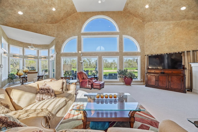 4126 Timberline Dr S, Fargo, ND 58104 - living area featuring healthy amount of natural light, high vaulted ceiling, recessed lighting, carpet, and ceiling fan