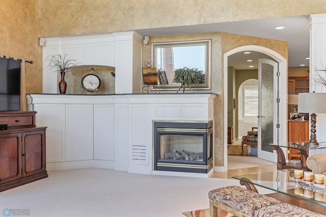 4126 Timberline Dr S, Fargo, ND 58104 - living area with arched walkways and a multi sided fireplace
