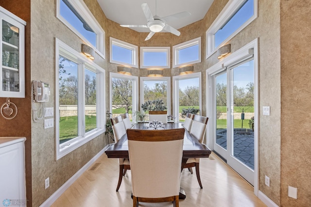 4126 Timberline Dr S, Fargo, ND 58104 - sunroom with wood finished floors, baseboards, and a high ceiling